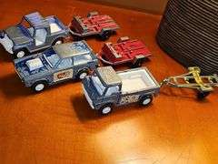 Diecast vehicles. All have been played with. The train in the front is Midge Toy, most of the rest are Tootsie Toy.