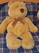 Commonwealth tan teddy bear with bowtie.