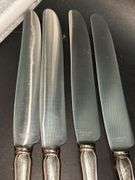 (4) Sterling Dinner Knives with Sterling handle and stainless blade……maker is not visible on back…..needs polished