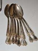 Old company plate flatware possibly Signature Rose pattern. 12 dinner forks, 10 dinner knives six soup spoons 9 teaspoons monogrammed H. Circa 1940s