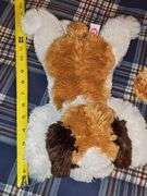 Two FAO Schwartz bears and a TY Beanie Buddy dog.
