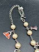 Adjustable waist size iridescent pearl-like beaded belt with charms