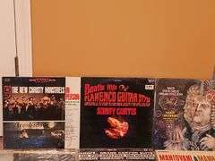 Grouping of albums. New Christy minstrels, Beatles flamenco guitar style by Sonny Curtis, Bach organ toccatas, and more.