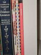 Grouping of children's books and a Bible verse.