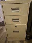 Three-drawer metal file cabinet...