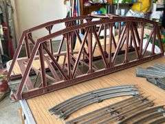 60qt Clear View tub of Lionel O Gauge train tracks, MARX controllers, bridge, trestle…..there is rust and guarantees that set is complete….please see all pics, especially seller’s pic of complete setup