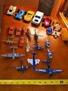 Toy vehicle grouping. Larger vehicles in the back are plastic, planes and General Lee cars or metal diecast.