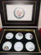 Grouping of golf balls. All boxes are full. Spalding, Titleist, and briarcrest saints.