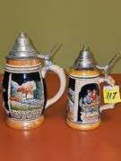 2 steins. One is 7.25 in from West Germany,  8.25 in is from Germany