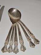 Old company plate flatware possibly Signature Rose pattern. 12 dinner forks, 10 dinner knives six soup spoons 9 teaspoons monogrammed H. Circa 1940s