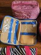 Travel bags, cosmetic bags, tote bags, travel alarm clocks and more.
