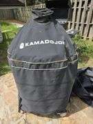 Red Kamado Joe Grill on rollaround iron stand w/cover and some like new accessories...