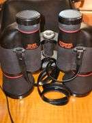 Simmons binoculars with lens caps and bag.