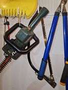 Yard tools as shown. Loppers clippers black and Decker electric 22-in hedge trimmer leaf grabbers.