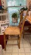 Exquisite custom built table and chairs……custom built in 1972 in Nicosia, Cyprus from oak(?). There are no nails except on the chairs to hold the rush seating in place. Chairs are hand carved…..one small blemish on table top