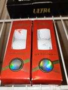 Grouping of golf balls. All boxes are full. Spalding, Titleist, and briarcrest saints.