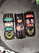 Vintage Hot wheel carrying case and cars as shown. One redline wheel in this grouping. Dukes of Hazzard car is Ertl.