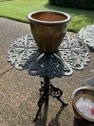 Pair of wrought iron plant stands…..21-1-2”D x 27 & 28-1/2 tall…..both are in used condition and need TLC….also included are 3 various size ceramic planters