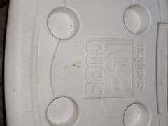 Igloo ice cube cooler on wheels.