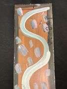 Original signed Mose T light green snake Folk Art with signature soda can tab hanger…..4-1/2 x 21-1/2