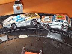 Vintage Hot wheel carrying case and cars as shown. Four redline wheels in this grouping.