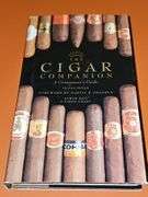 Two Sir Winston wood cigar boxes, cigar pen, and The Cigar Companion hardback book with dust cover.