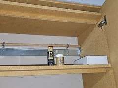 Cabinet contents as shown. Cabinet is not included.