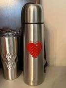 Selection of insulated drink containers and (1) glass sports bottle…..all are NEW and far right silver piece has a dent in the top and comes with carry case (see all pics as more were added) cups are by Primula