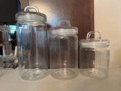 Selection of (3) Kirkland’s glass canisters with rubber seal around lids…..sizes range from 7-1/2 to 11-1/2” tall