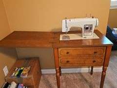 Vintage Sears Kenmore sewing machine in cabinet with storage chair. Closed cabinet is 22.5x18 X 30 in tall. Chair is 16 X 13 X 27.5 in tall. Seat height is 17 in