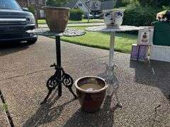 Pair of wrought iron plant stands…..21-1-2”D x 27 & 28-1/2 tall…..both are in used condition and need TLC….also included are 3 various size ceramic planters