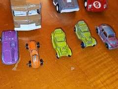 Diecast vehicles. All have been played with. The train in the front is Midge Toy, most of the rest are Tootsie Toy.