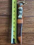 Original Buffalo Skinner knife from Silver Springs Florida with imitation bone handle and leather sheath.