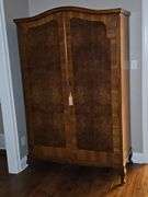 Fabulous antique armoire With burl wood inlay, repurposed as a cabinet. 48 x21.5x 78 in tall.