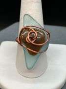 Uniquely designed copper wire ring with blue & brown stone…..size 10