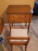 Vintage Sears Kenmore sewing machine in cabinet with storage chair. Closed cabinet is 22.5x18 X 30 in tall. Chair is 16 X 13 X 27.5 in tall. Seat height is 17 in