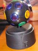 Magnetic dart board (missing 1 red dart), bobblehead Einstein needs battery, and mini Disco light works.