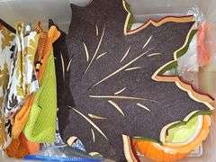 Two tubs of fall decor.