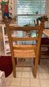 Exquisite custom built table and chairs……custom built in 1972 in Nicosia, Cyprus from oak(?). There are no nails except on the chairs to hold the rush seating in place. Chairs are hand carved…..one small blemish on table top