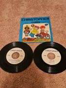 Grouping of 45's records. "Christopher" is a vintage Captain Kangaroo version. See all photos for various titles.