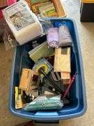 31 gallon tote and contents…..NEW King Size mattress protector, SubZero bottles, NEW kitchen gadgets and much more (no lid for tote)