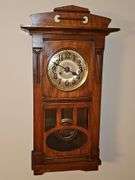 Antique pendulum clock. Chimes on half hour and counts whole hours. Did not locate a maker. Was operating properly at time of listing. 11x7.5 x 30 in tall.