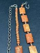 Adjustable waist size rust colored beaded ladies belt
