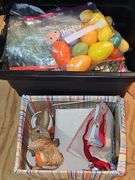 Two containers of decorative Easter items.