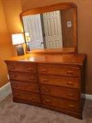 Empire Furniture Corp 8 drawer dresser with mirror, and lamp. Decal on mirror is adhesive. 54 x 20.5 x31 in tall. Mirror is 42.5x 33 in tall. Lamp is 17.5 in tall. Contents not included.