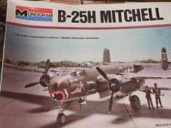 Unopened model airplane, model car, paint brushes and paints