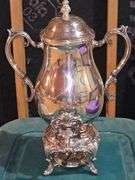 Tub of silver plate items. Two teapots, heated coffee pot, covered sugar, and creamer.
