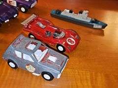 Diecast vehicles. All have been played with. The train in the front is Midge Toy, most of the rest are Tootsie Toy.