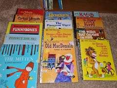 Bookcase and great grouping of children's books. Bookcase is 21.25 X 10.75 x 28.25 in tall. See all photos for titles.