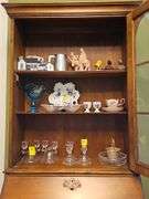 Wood secretary with two doors and 3 drawers. Keys work locks properly. 26.5 x 15.5x 71.5 in tall. Content's not included.